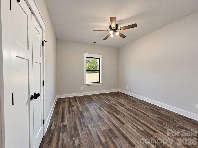 25011 Elias Trails Road, Locust, NC 28097.  MLS# CAR4420599, YatesRealty ID 50518. Front Bedroom
