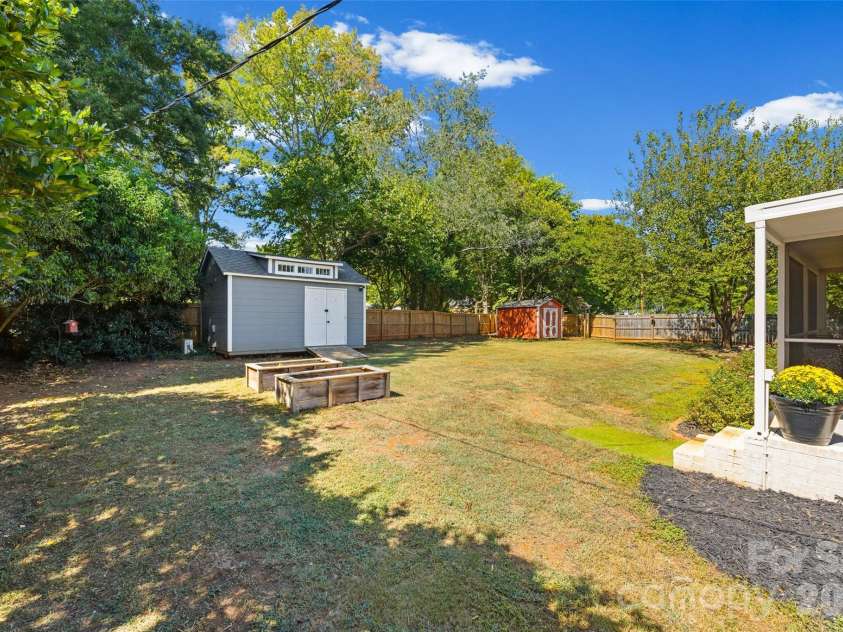 1654 Colony Road, Rock Hill, SC 29730.  MLS# CAR4422027, YatesRealty ID 50524. Backyard with sheds