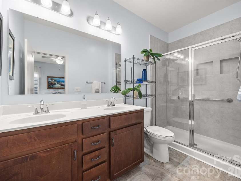 22444 Gateway Drive, Lancaster, SC 29720.  MLS# CAR4420813, YatesRealty ID 50525. Primary bathroom with double vanity and walk-in shower