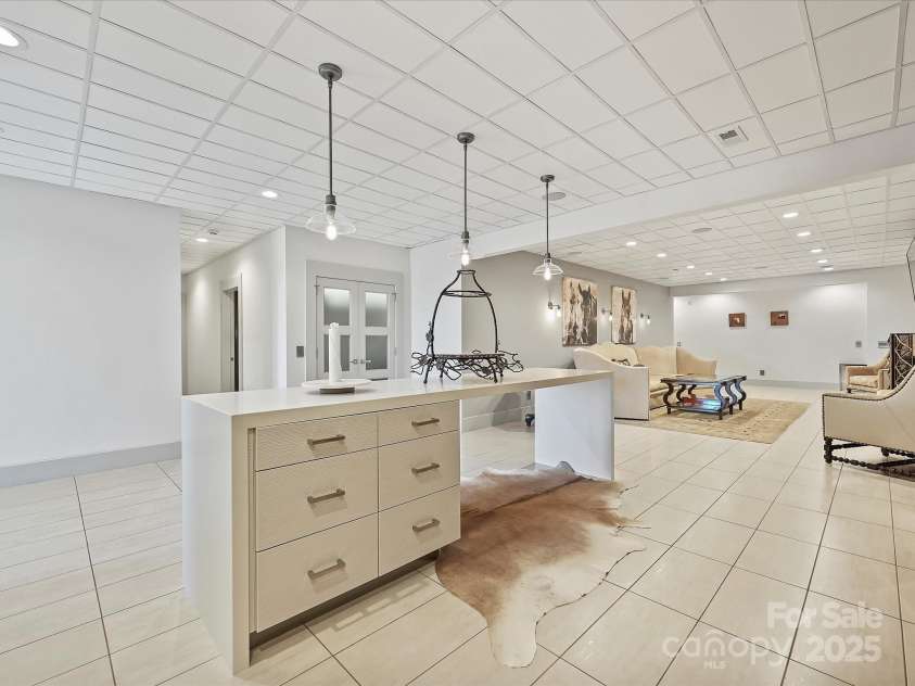 172 Tuckertown Road, New London, NC 28127.  MLS# CAR4215273, YatesRealty ID 5053. Kitchen Island Lower Level