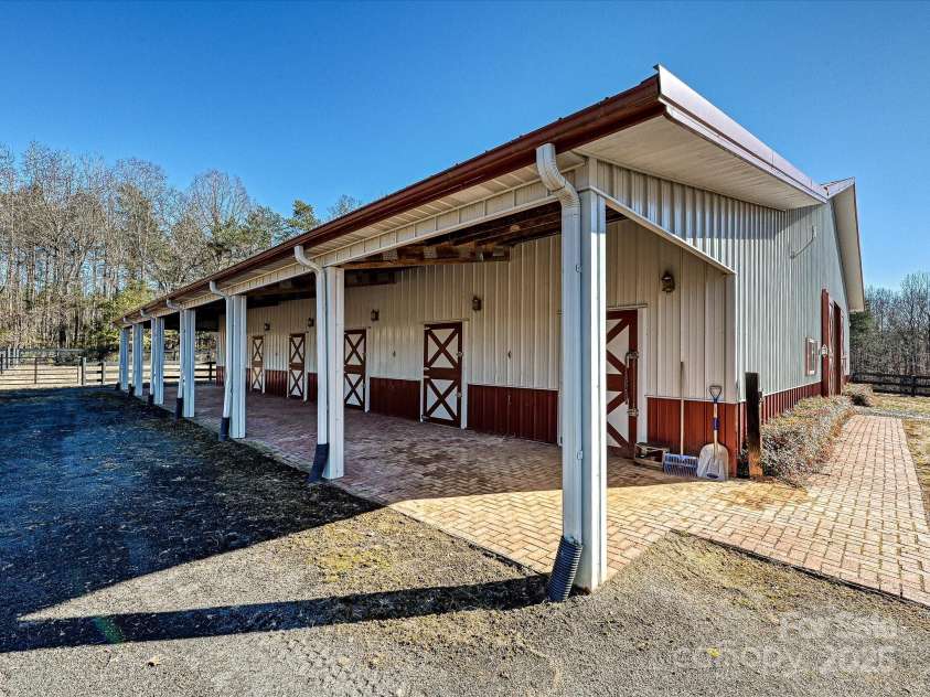 172 Tuckertown Road, New London, NC 28127.  MLS# CAR4215273, YatesRealty ID 5053. Shedrow Stalls