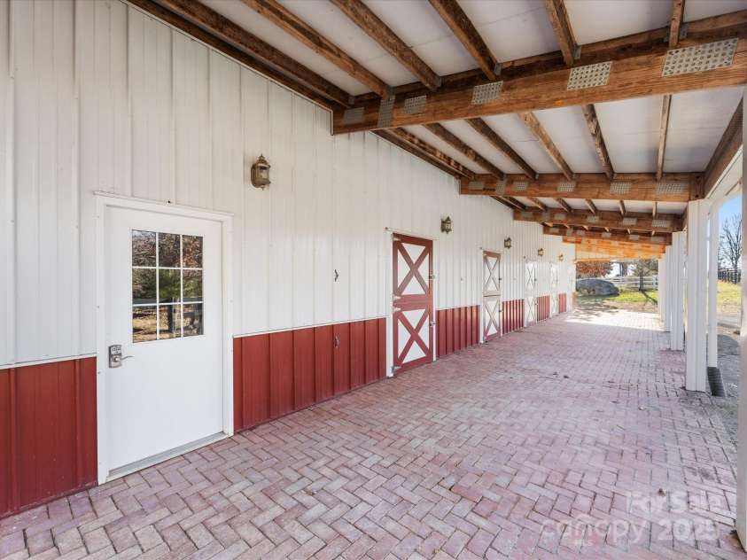 172 Tuckertown Road, New London, NC 28127.  MLS# CAR4215273, YatesRealty ID 5053. Shedrow Stalls with Dutch Doors