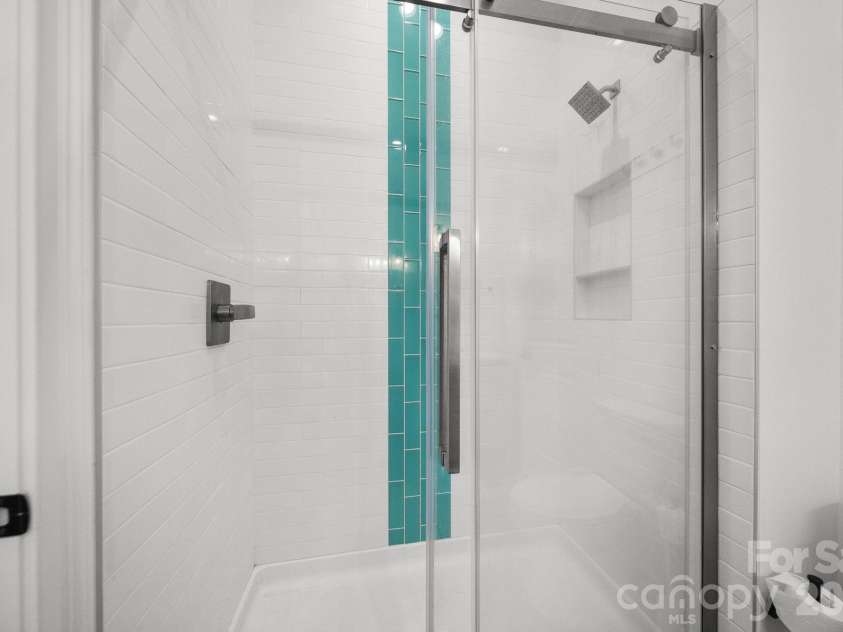4035 Daugherty Road, China Grove, NC 28023.  MLS# CAR4417905, YatesRealty ID 50534. Custom tile shower in jack and jill bathroom