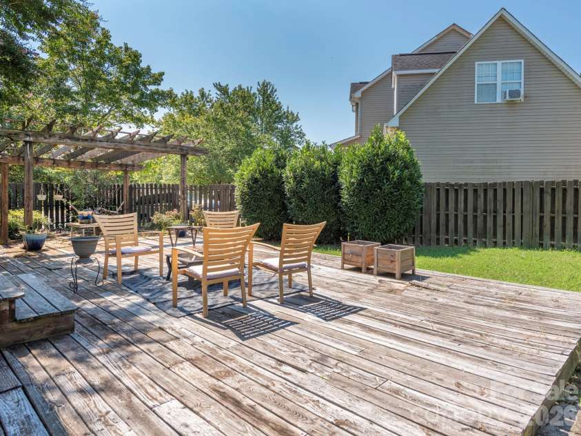 3401 Continental Drive, Monroe, NC 28110.  MLS# CAR4420024, YatesRealty ID 50540. Backyard deck and pergola