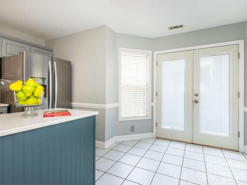 3401 Continental Drive, Monroe, NC 28110.  MLS# CAR4420024, YatesRealty ID 50540. Breakfast area with French doors to the backyard and deck.