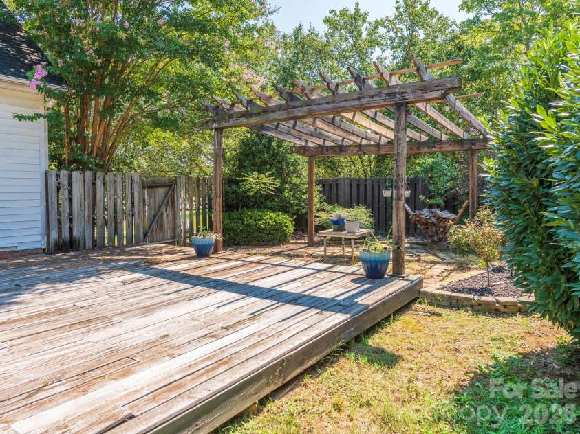 3401 Continental Drive, Monroe, NC 28110.  MLS# CAR4420024, YatesRealty ID 50540. Deck looking onto the pergola area