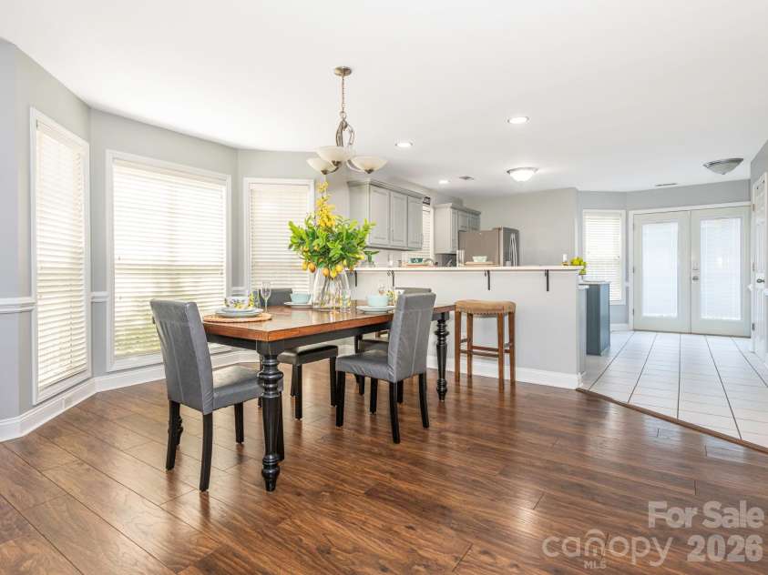 3401 Continental Drive, Monroe, NC 28110.  MLS# CAR4420024, YatesRealty ID 50540. Dining area and breakfast bar with seating