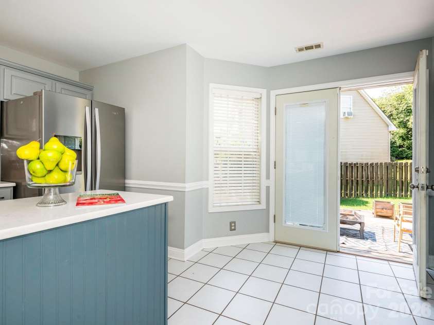 3401 Continental Drive, Monroe, NC 28110.  MLS# CAR4420024, YatesRealty ID 50540. Kitchen French doors offer convenient direct access to the fenced backyard
