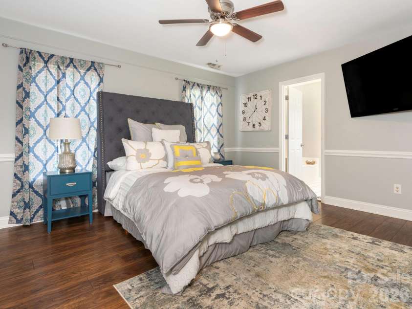 3401 Continental Drive, Monroe, NC 28110.  MLS# CAR4420024, YatesRealty ID 50540. Lovely Primary Bedroom featuring beautiful wood flooring