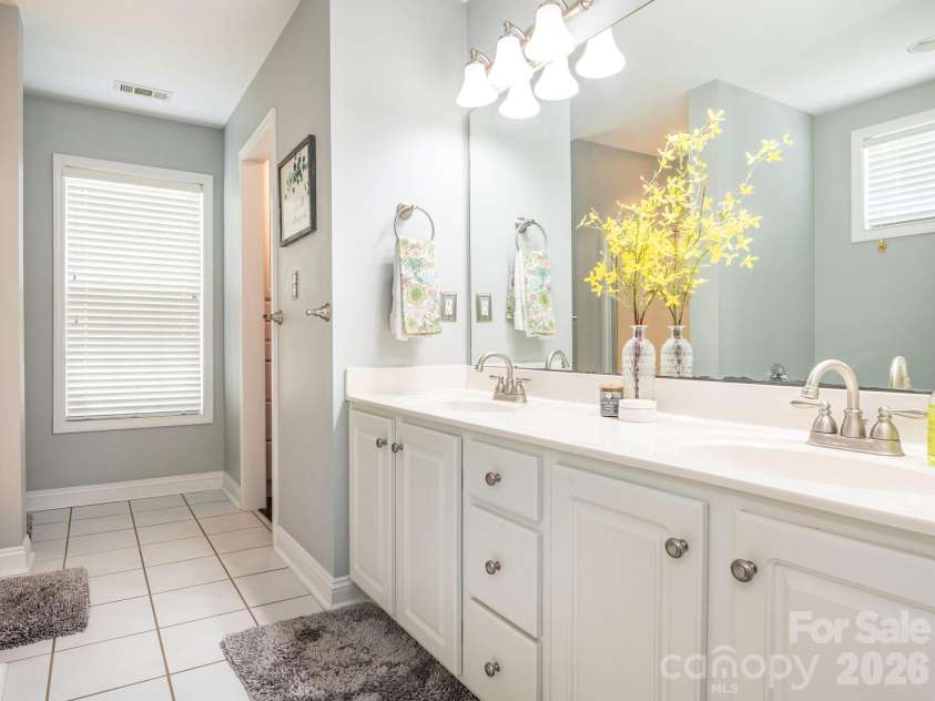 3401 Continental Drive, Monroe, NC 28110.  MLS# CAR4420024, YatesRealty ID 50540. Primary Bath with dual sinks and tile flooring