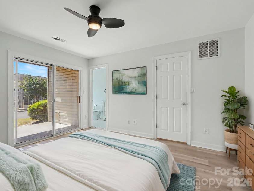 14546 Waterside Drive, Charlotte, NC 28278.  MLS# CAR4423236, YatesRealty ID 50546. Virtually staged lower primary suite.