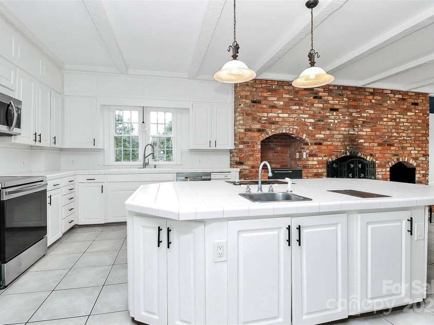 106 Patrick Street, Gastonia, NC 28054.  MLS# CAR4211369, YatesRealty ID 5055. Kitchen has 2 sinks, 2 disposals and 2 electric cook tops.