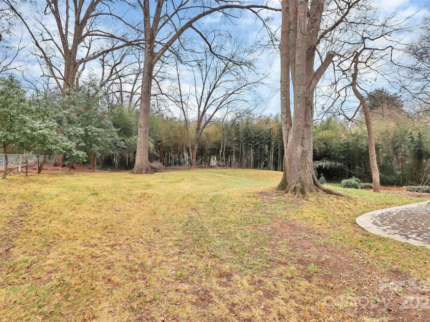 106 Patrick Street, Gastonia, NC 28054.  MLS# CAR4211369, YatesRealty ID 5055. Over one acre lot with beautiful backyard.