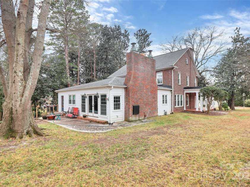 106 Patrick Street, Gastonia, NC 28054.  MLS# CAR4211369, YatesRealty ID 5055. Rear of home with amazing old trees and tons of privacy in the city.