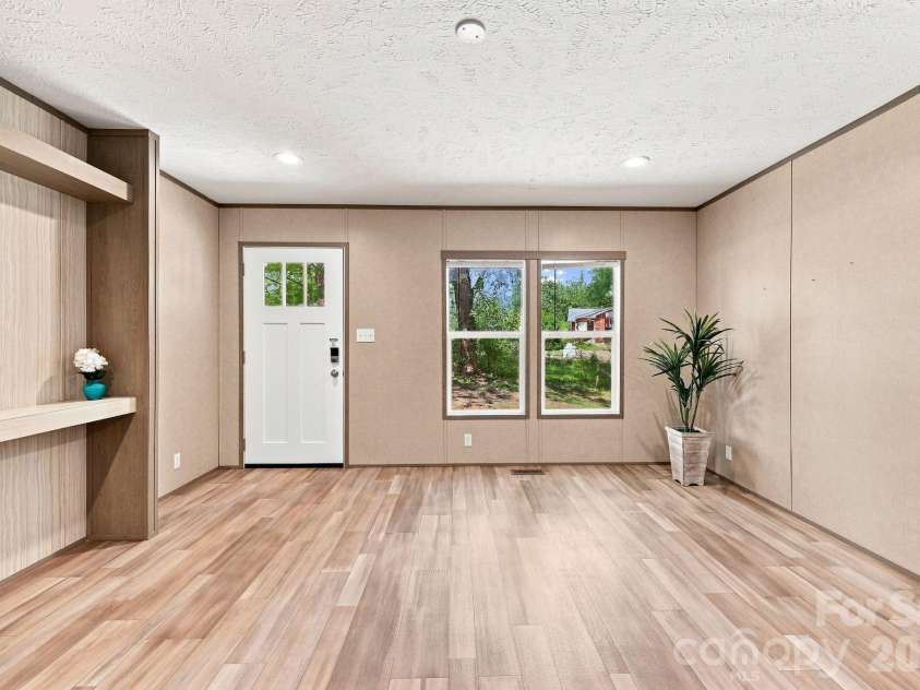 146 & 148 Bradshaw Circle, Candler, NC 28715.  MLS# CAR4424703, YatesRealty ID 50552. Large Living Room with Open Living Plan