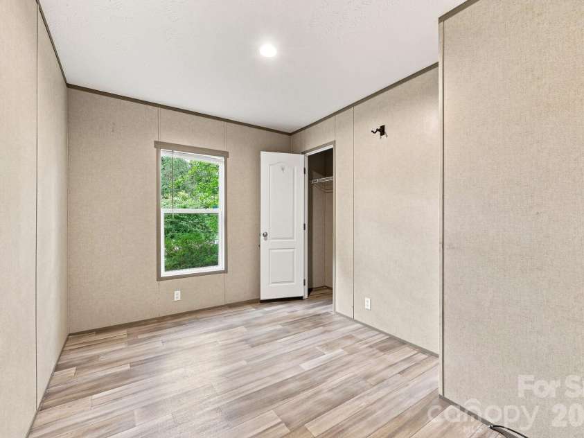 146 & 148 Bradshaw Circle, Candler, NC 28715.  MLS# CAR4424703, YatesRealty ID 50552. Second Bedroom or Office