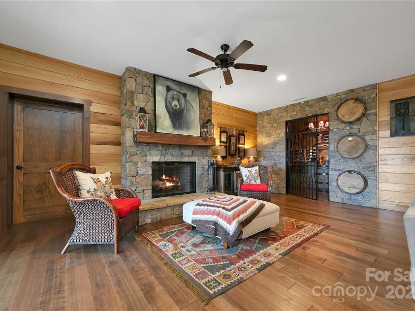 1291 Indian Camp Mountain Road, Rosman, NC 28772.  MLS# CAR4282700, YatesRealty ID 5056. Lower level stone fireplace