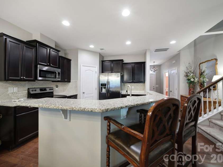 7021 Woodsbay Lane, Rock Hill, SC 29732.  MLS# CAR4423868, YatesRealty ID 50578. Kitchen with Breakfast Bar