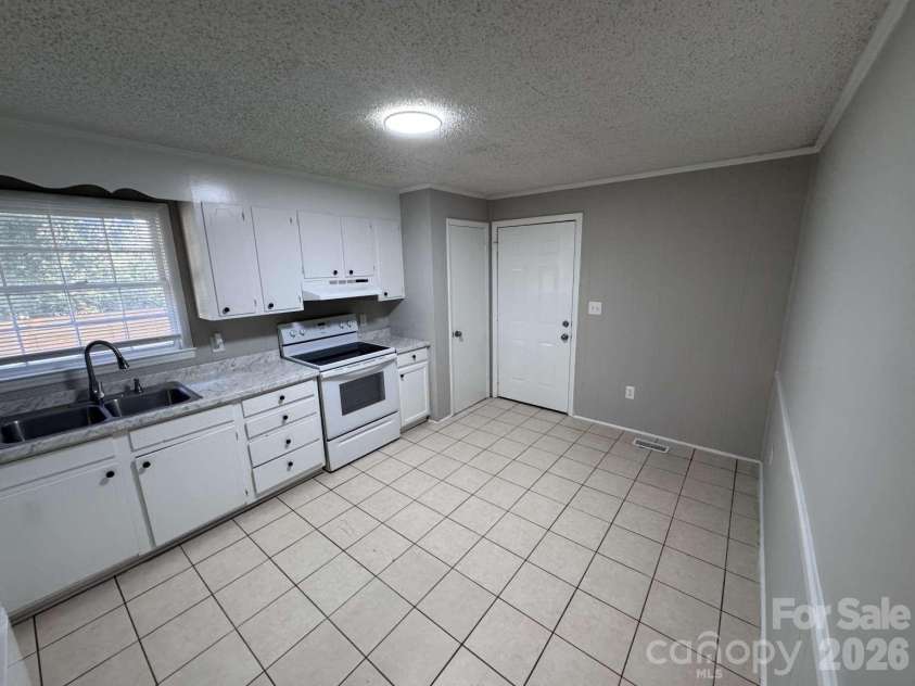 99 Mcginnis Place, Mount Holly, NC 28120.  MLS# CAR4424141, YatesRealty ID 50589. 