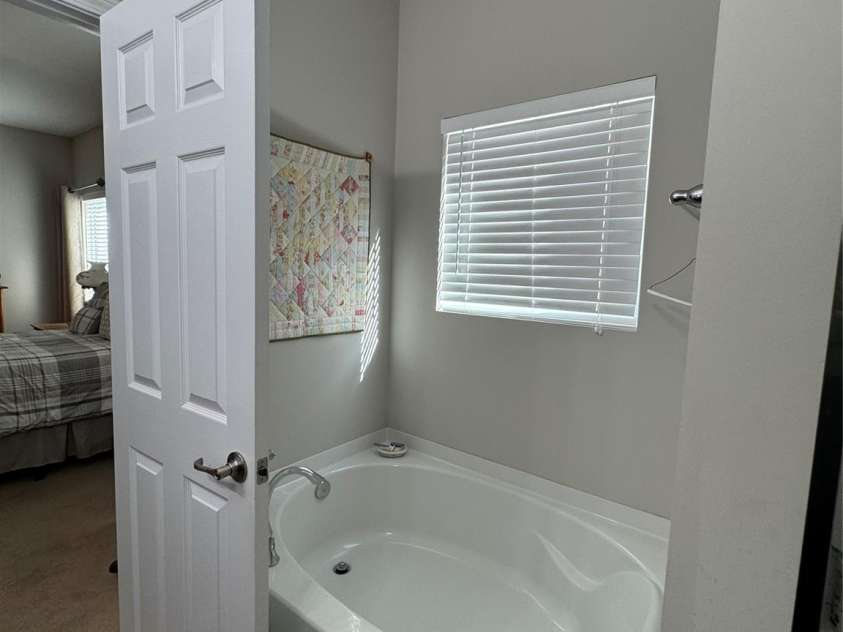 905 Roxburgh Avenue, Rock Hill, SC 29732.  MLS# CAR4237450, YatesRealty ID 5059. Primary bedroom has a ceiling fan and spacious walk in closet.