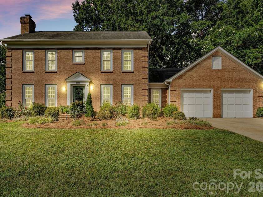 2010 Glendalough Lane, Matthews, NC 28105.  MLS# CAR4422535, YatesRealty ID 50595. Front Exterior (Virtual Twilight)
