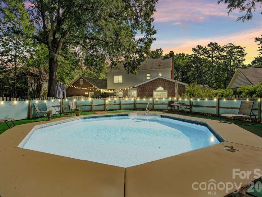 2010 Glendalough Lane, Matthews, NC 28105.  MLS# CAR4422535, YatesRealty ID 50595. In-Ground Pool (Virtual Twilight)
