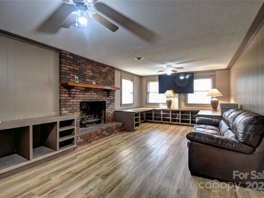 119 Pleasant Hill Circle, Waynesville, NC 28786.  MLS# CAR4325217, YatesRealty ID 506. Large lower level family room with a fireplace