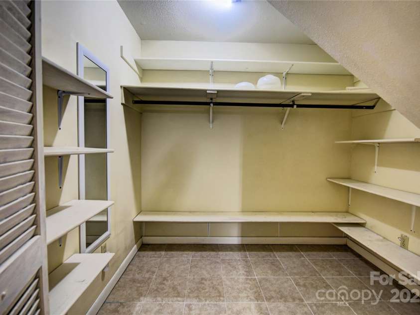 119 Pleasant Hill Circle, Waynesville, NC 28786.  MLS# CAR4325217, YatesRealty ID 506. Large Storage Closet on the basement level