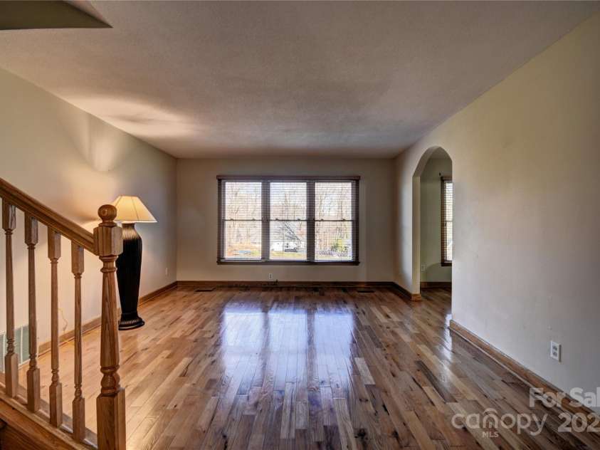 119 Pleasant Hill Circle, Waynesville, NC 28786.  MLS# CAR4325217, YatesRealty ID 506. Living Room with windows overlooking the backyard