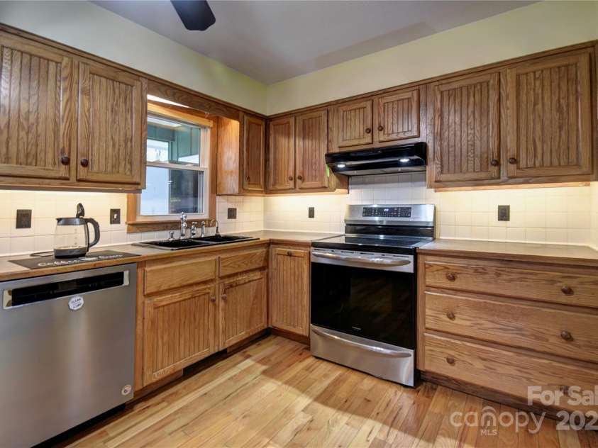119 Pleasant Hill Circle, Waynesville, NC 28786.  MLS# CAR4325217, YatesRealty ID 506. Main part of the kitchen with SS appliances and lots of cabinets