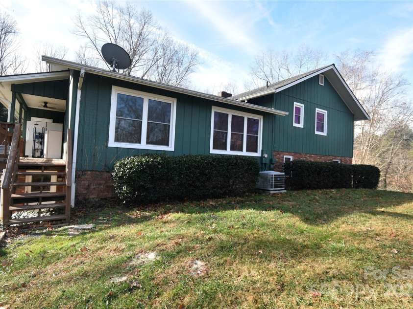 119 Pleasant Hill Circle, Waynesville, NC 28786.  MLS# CAR4325217, YatesRealty ID 506. Rear View of the home and steps to the porch/deck