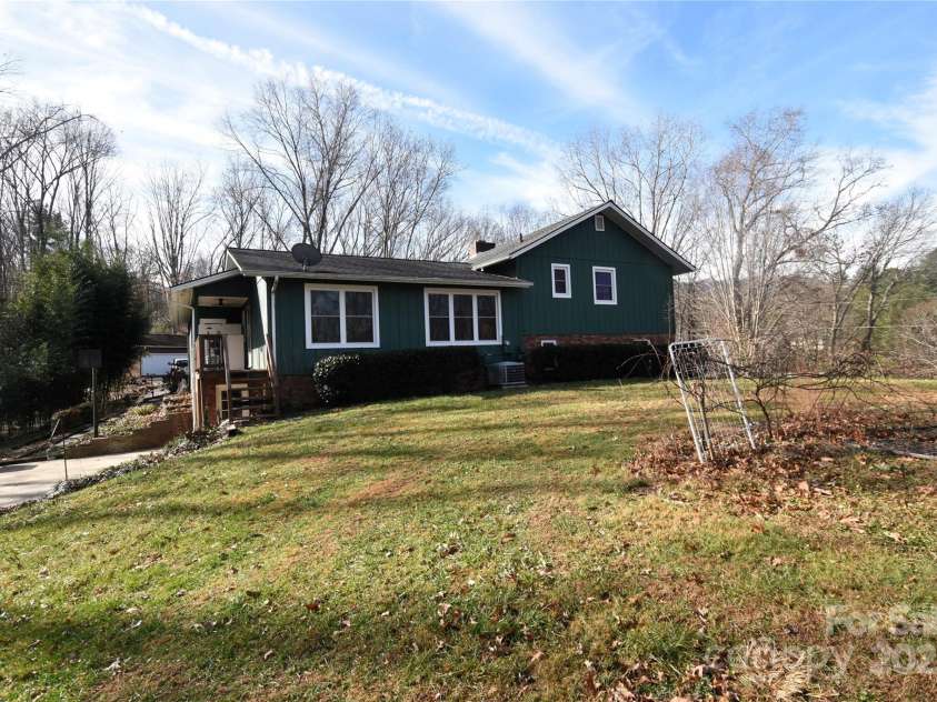 119 Pleasant Hill Circle, Waynesville, NC 28786.  MLS# CAR4325217, YatesRealty ID 506. Rear View of the home from the large backyard