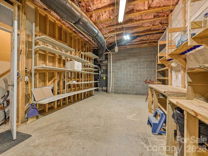 152 Lighthouse Road, Mount Holly, NC 28120.  MLS# CAR4389508, YatesRealty ID 5060. Basement workshop/storage area