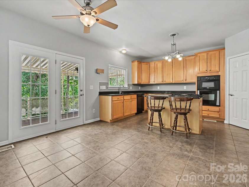 152 Lighthouse Road, Mount Holly, NC 28120.  MLS# CAR4389508, YatesRealty ID 5060. Breakfast area opens out to covered deck