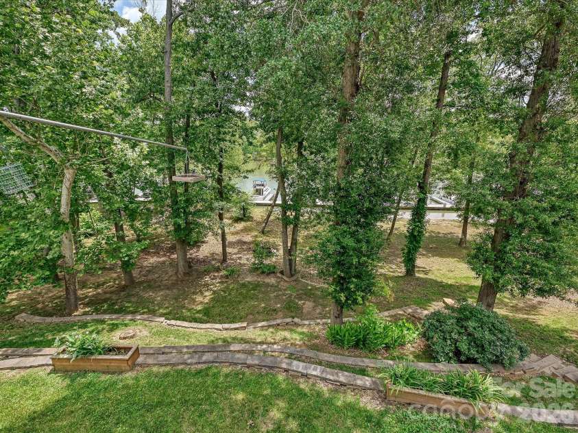 152 Lighthouse Road, Mount Holly, NC 28120.  MLS# CAR4389508, YatesRealty ID 5060. Catawba River-front home