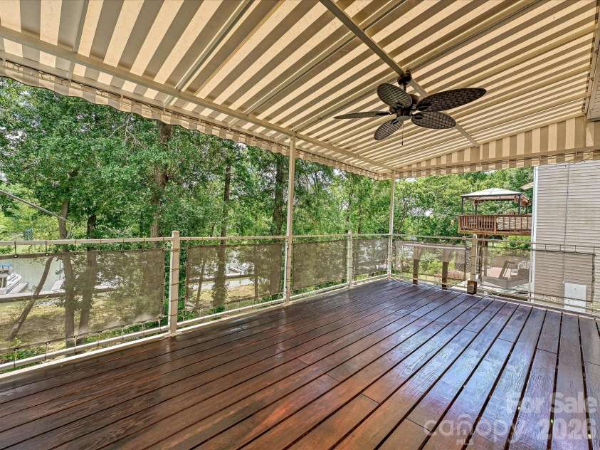 152 Lighthouse Road, Mount Holly, NC 28120.  MLS# CAR4389508, YatesRealty ID 5060. Deck with awning and canvas attached to railing