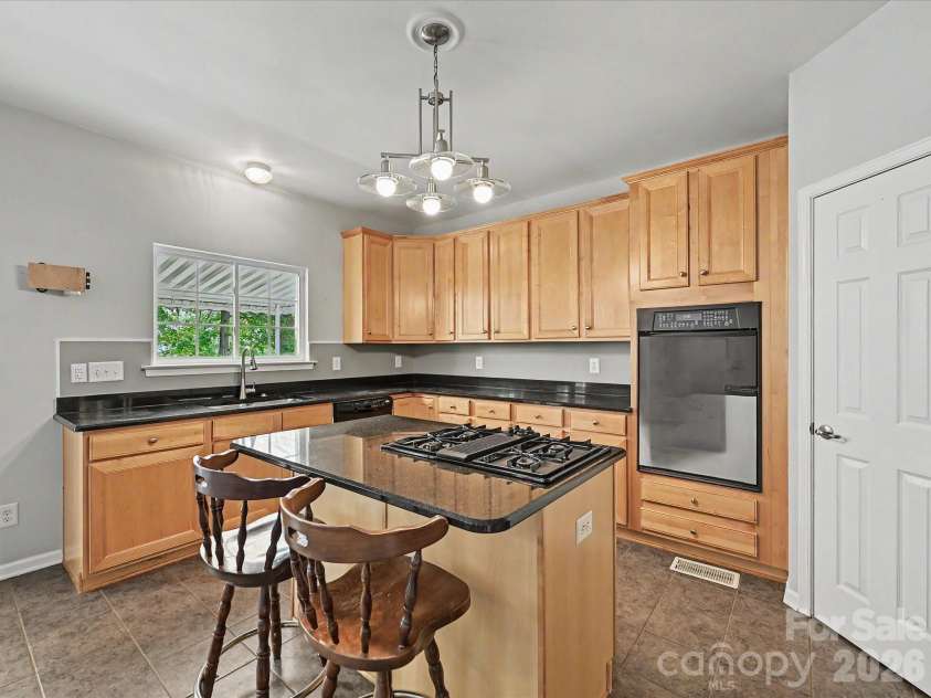 152 Lighthouse Road, Mount Holly, NC 28120.  MLS# CAR4389508, YatesRealty ID 5060. Kitchen with granite counters and island