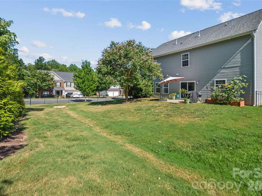 4901 Annelise Drive, Harrisburg, NC 28075.  MLS# CAR4424129, YatesRealty ID 50605. Back Yard Side View