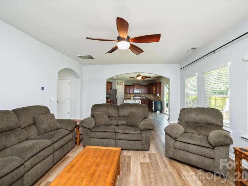 4901 Annelise Drive, Harrisburg, NC 28075.  MLS# CAR4424129, YatesRealty ID 50605. Den and Kitchen