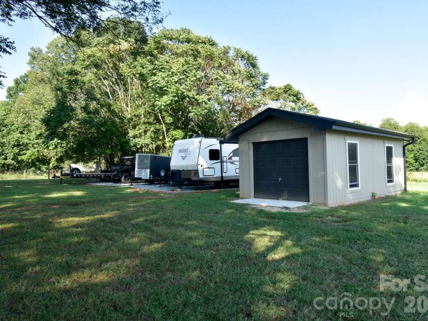 541 Perry Road, Troutman, NC 28166.  MLS# CAR4422089, YatesRealty ID 50609. Detached garage and trailer/camper parking