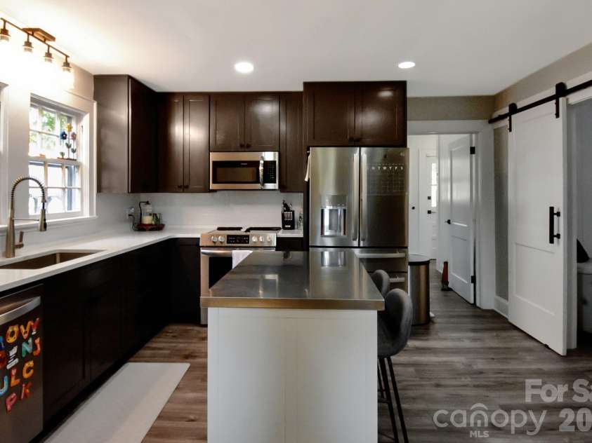 541 Perry Road, Troutman, NC 28166.  MLS# CAR4422089, YatesRealty ID 50609. Kitchen with stainless appliances