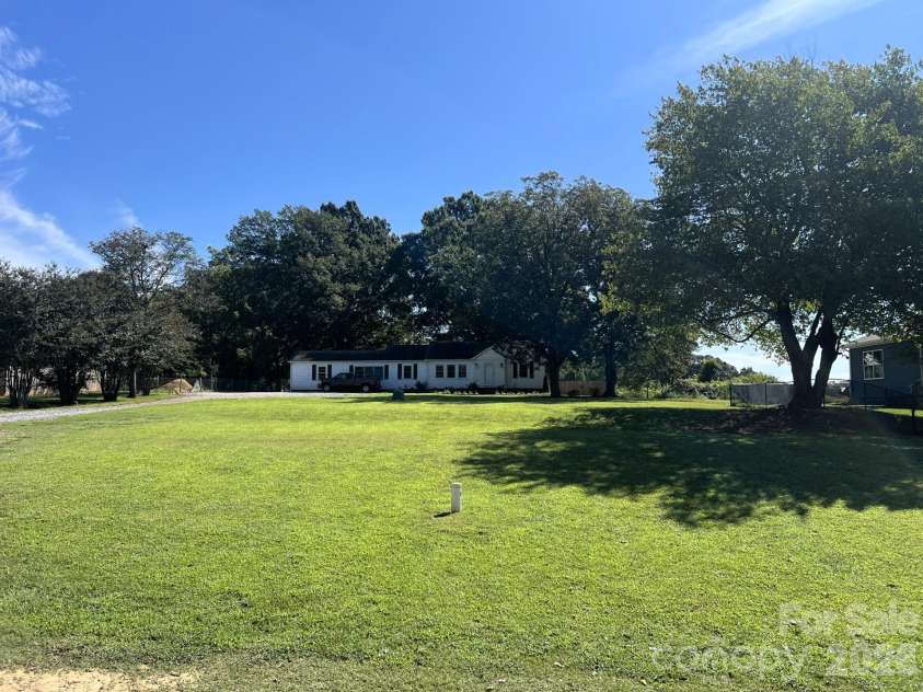541 Perry Road, Troutman, NC 28166.  MLS# CAR4422089, YatesRealty ID 50609. Setback from the road!