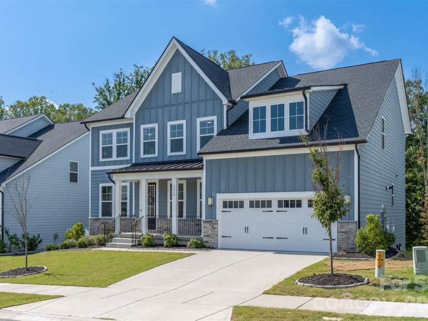 4320 Tournette Drive, Indian Land, SC 29707.  MLS# CAR4420198, YatesRealty ID 50610. Front elevation with two-car garage