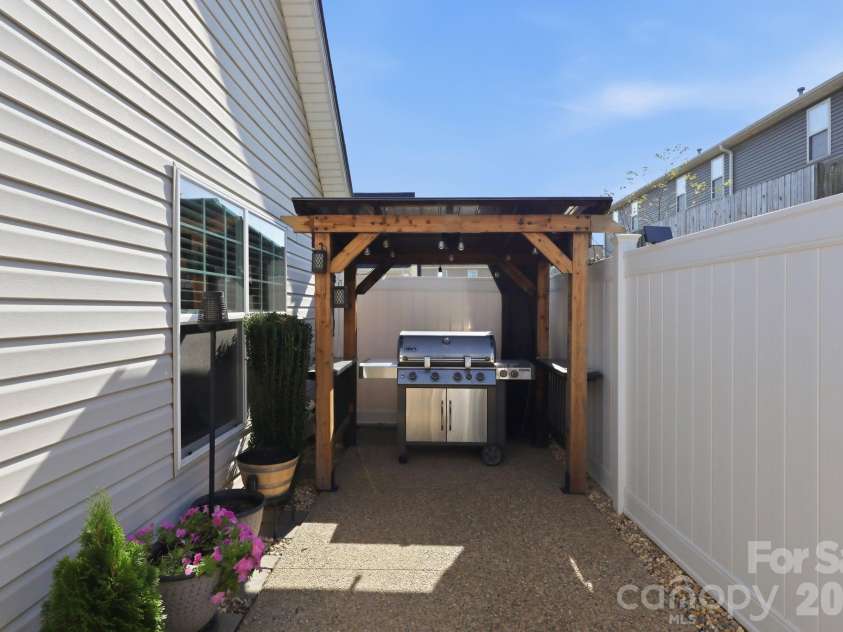 72 Sunny Meadows Boulevard, Arden, NC 28704.  MLS# CAR4421801, YatesRealty ID 50614. Back Patio - Gas Grill Area