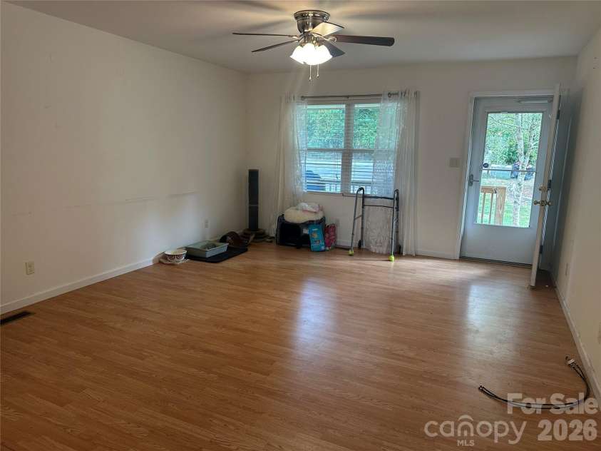 6 Kendrick Court, Flat Rock, NC 28731.  MLS# CAR4414981, YatesRealty ID 50622. Living room with open concept