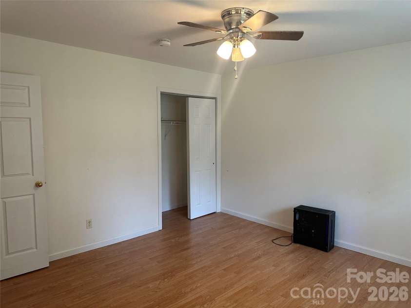 6 Kendrick Court, Flat Rock, NC 28731.  MLS# CAR4414981, YatesRealty ID 50622. Primary bedroom with 2 closets