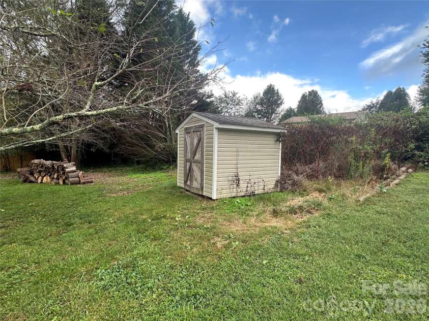 6 Kendrick Court, Flat Rock, NC 28731.  MLS# CAR4414981, YatesRealty ID 50622. Shed in the backyard