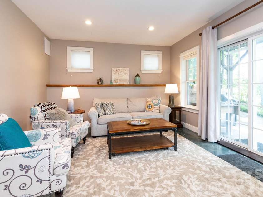 278 Brevard Road, Asheville, NC 28806.  MLS# CAR4408932, YatesRealty ID 50646. Lower Level Living Room