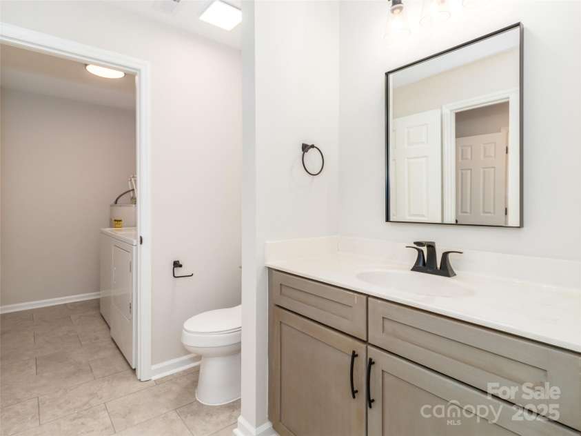 3210 Selwyn Farms Lane, Charlotte, NC 28209.  MLS# CAR4241190, YatesRealty ID 5065. View from Guest sink to laundry