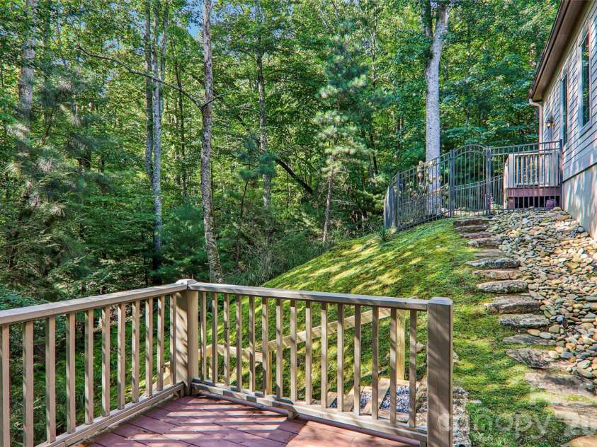 361 Mills River Way, Horse Shoe, NC 28742.  MLS# CAR4423037, YatesRealty ID 50654. Backyard view